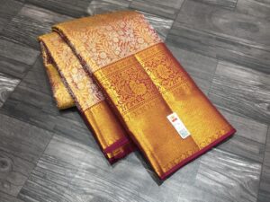 Golden bridal Kanchipuram sarees with maroon border